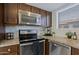 Well-equipped kitchen featuring granite countertops, stainless steel appliances, and ample cabinet space at 9990 N Scottsdale Rd # 2020, Paradise Valley, AZ 85253