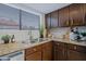 Well-lit kitchen featuring granite countertops, stainless steel appliances, and updated cabinets at 9990 N Scottsdale Rd # 2020, Paradise Valley, AZ 85253