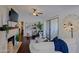 Spacious living area with a fireplace, hardwood floors, and access to a private patio at 9990 N Scottsdale Rd # 2020, Paradise Valley, AZ 85253