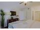 Bright main bedroom with wood floors, a ceiling fan, and plenty of natural light at 9990 N Scottsdale Rd # 2020, Paradise Valley, AZ 85253