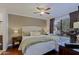 Comfortable main bedroom with a ceiling fan, wood floors, and natural light at 9990 N Scottsdale Rd # 2020, Paradise Valley, AZ 85253