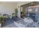 Charming patio with seating, a table, and view inside living area at 9990 N Scottsdale Rd # 2020, Paradise Valley, AZ 85253