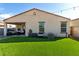 Expansive backyard showcasing an artificial turf lawn and covered patio with outdoor seating at 1018 S 5Th St, Avondale, AZ 85323