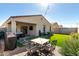 Inviting backyard featuring a brick patio with outdoor seating and a lush artificial grass lawn at 1018 S 5Th St, Avondale, AZ 85323