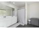 This bathroom features a double vanity, and clean white finishes, providing functionality and style at 1018 S 5Th St, Avondale, AZ 85323