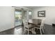 Cozy dining area with a wooden table, four chairs, and sliding glass door to the backyard at 1018 S 5Th St, Avondale, AZ 85323