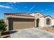 Charming single-Gathering home featuring a two-car garage, tile roof, and low-maintenance landscaping at 1018 S 5Th St, Avondale, AZ 85323