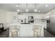 Bright kitchen featuring a large island with pendant lighting, stainless steel appliances, and white cabinetry at 1018 S 5Th St, Avondale, AZ 85323