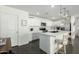 Bright and modern kitchen with white cabinetry, stainless steel appliances, a central island and pendant lighting at 1018 S 5Th St, Avondale, AZ 85323