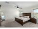 This bedroom features carpet floors, a ceiling fan and natural light, creating a cozy retreat at 1018 S 5Th St, Avondale, AZ 85323