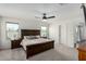 This bedroom features carpet floors, a ceiling fan and natural light, creating a cozy retreat at 1018 S 5Th St, Avondale, AZ 85323