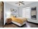 Comfortable bedroom with a ceiling fan, wooden floors, and natural light at 10224 N Azure Vista Trl, Fountain Hills, AZ 85268