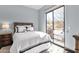 Bedroom with a plush bed and sliding glass door leading to a patio at 10224 N Azure Vista Trl, Fountain Hills, AZ 85268