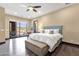 Bright bedroom with hardwood floors, slider doors to patio, and neutral tones at 10224 N Azure Vista Trl, Fountain Hills, AZ 85268