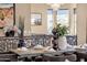 Open dining area with wrought iron railings overlooking the space, stylish table setting, and natural lighting at 10224 N Azure Vista Trl, Fountain Hills, AZ 85268