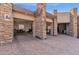 Exterior view of the garage with stone accents and open doors, revealing a spacious interior with ample storage at 10224 N Azure Vista Trl, Fountain Hills, AZ 85268