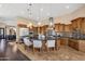 Spacious kitchen features custom cabinetry, stainless steel appliances, large island with pendant lighting at 10224 N Azure Vista Trl, Fountain Hills, AZ 85268