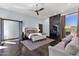 Stylish main bedroom with a comfortable seating area, fireplace, and elegant decor at 10224 N Azure Vista Trl, Fountain Hills, AZ 85268