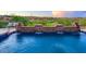 A tranquil pool featuring stone accents and a water feature, set against a backdrop of lush greenery and an inviting seating area at 10224 N Azure Vista Trl, Fountain Hills, AZ 85268