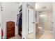 Bathroom featuring a closet on the left, a full door mirror, and a shower and toilet at 10511 W Wheatridge Dr, Sun City, AZ 85373