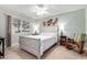 Cozy bedroom featuring a ceiling fan, window, and decor at 10511 W Wheatridge Dr, Sun City, AZ 85373