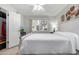 Bedroom featuring ceiling fan, window, and closet with a tv on the wall at 10511 W Wheatridge Dr, Sun City, AZ 85373