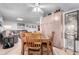 Open dining room with a wooden table, storage cabinets, and seamless access to the living area at 10511 W Wheatridge Dr, Sun City, AZ 85373