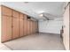 A spacious garage featuring a large amount of storage space via built in cabinets at 10511 W Wheatridge Dr, Sun City, AZ 85373