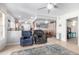 Open concept living room with ceiling fans, recessed lighting, and tile flooring throughout at 10511 W Wheatridge Dr, Sun City, AZ 85373