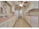 Classic kitchen with ample cabinet space, laminate countertops, and a view of the backyard at 10650 W Riviera Dr, Sun City, AZ 85351