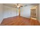 Spacious main bedroom featuring hardwood floors, ensuite bathroom, and plenty of natural light at 10650 W Riviera Dr, Sun City, AZ 85351