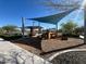 Community playground featuring shade and a fun climbing structure at 10983 W Mckinley St, Avondale, AZ 85323