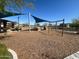 Community playground with shade and swings in a beautiful neighborhood at 10983 W Mckinley St, Avondale, AZ 85323