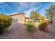 Spacious backyard with desert landscaping and a covered patio at 11955 W Granada Rd, Avondale, AZ 85392