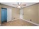 Bedroom featuring a ceiling fan, wood-look flooring, and a closet for storage at 11955 W Granada Rd, Avondale, AZ 85392