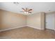 Spacious bedroom features wood-look flooring, and a white door leading to additional rooms at 11955 W Granada Rd, Avondale, AZ 85392