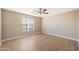 Inviting bedroom featuring wood-look flooring and a ceiling fan for added comfort at 11955 W Granada Rd, Avondale, AZ 85392