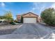 Charming single-story home with a well-maintained front yard, desert landscaping, and attached two car garage at 11955 W Granada Rd, Avondale, AZ 85392