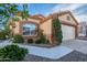 Charming single-story home with a well-maintained front yard and desert landscaping, close to the garage at 11955 W Granada Rd, Avondale, AZ 85392