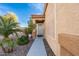 View of the front entrance of the charming single-story home with a well-maintained front yard and desert landscaping at 11955 W Granada Rd, Avondale, AZ 85392