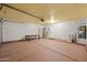 Spacious garage with painted floors, a water heater, and ample storage space at 11955 W Granada Rd, Avondale, AZ 85392