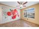 Living room boasts bright natural light, tile flooring, and decorative wall art at 11955 W Granada Rd, Avondale, AZ 85392