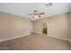 A generously sized main bedroom offering wood-look flooring, and an ensuite bath at 11955 W Granada Rd, Avondale, AZ 85392