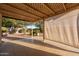 Covered patio in the backyard, perfect for outdoor relaxation and entertaining at 11955 W Granada Rd, Avondale, AZ 85392