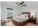 Bedroom with neutral tones, natural light, a ceiling fan, and modern furnishings at 12236 N 59Th St, Scottsdale, AZ 85254