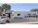 Stunning home with desert landscaping and modern architecture, including a sleek garage door at 12236 N 59Th St, Scottsdale, AZ 85254