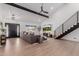 Spacious living room with high ceilings, modern staircase, wood floors, and abundant natural light at 12236 N 59Th St, Scottsdale, AZ 85254