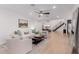 Bright living room with modern decor, wood floors, and a staircase, creating a stylish space at 12236 N 59Th St, Scottsdale, AZ 85254