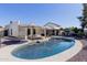 Inviting pool with sun loungers and umbrellas create a backyard oasis at 12236 N 59Th St, Scottsdale, AZ 85254