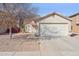 Charming single-story home with a two-car garage and low-maintenance desert landscaping at 12246 W Bloomfield Rd, El Mirage, AZ 85335